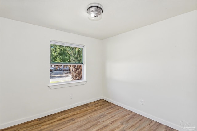 unfurnished room with light hardwood / wood-style flooring