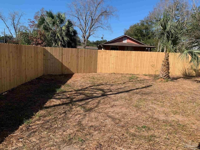 view of yard featuring a fenced backyard