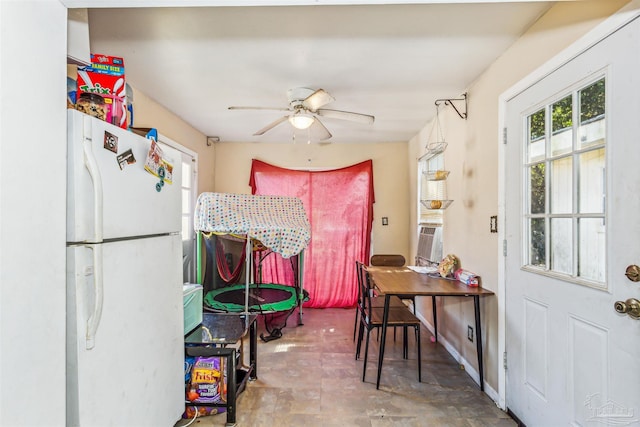 dining area with cooling unit and ceiling fan