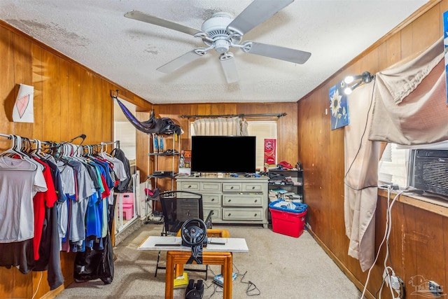 walk in closet with carpet and ceiling fan