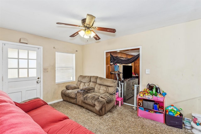 living room with ceiling fan and light carpet