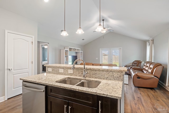 5726 Dunridge Dr, Pace, FL 32571 - kitchen featuring a sink, open floor plan, dishwasher, dark brown cabinetry, and vaulted ceiling