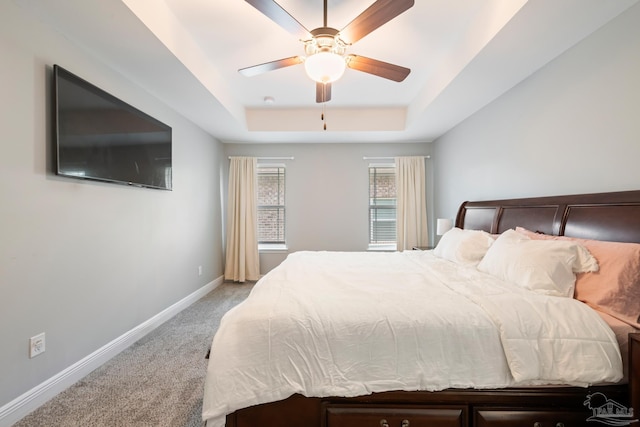 5726 Dunridge Dr, Pace, FL 32571 - bedroom featuring a raised ceiling, light carpet, baseboards, and ceiling fan