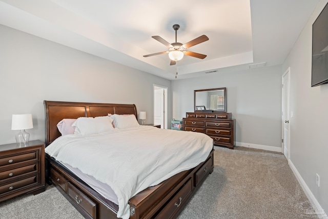 5726 Dunridge Dr, Pace, FL 32571 - bedroom with a raised ceiling, light colored carpet, baseboards, and a ceiling fan