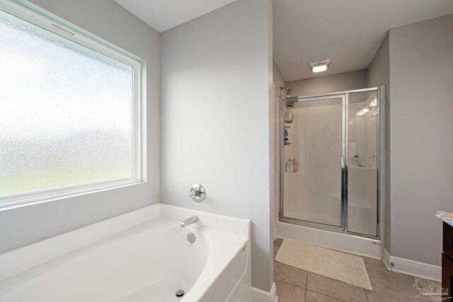 5726 Dunridge Dr, Pace, FL 32571 - full bath featuring a shower stall, plenty of natural light, and tile patterned flooring