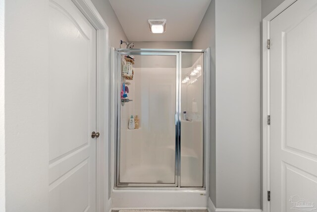 5726 Dunridge Dr, Pace, FL 32571 - bathroom featuring a stall shower
