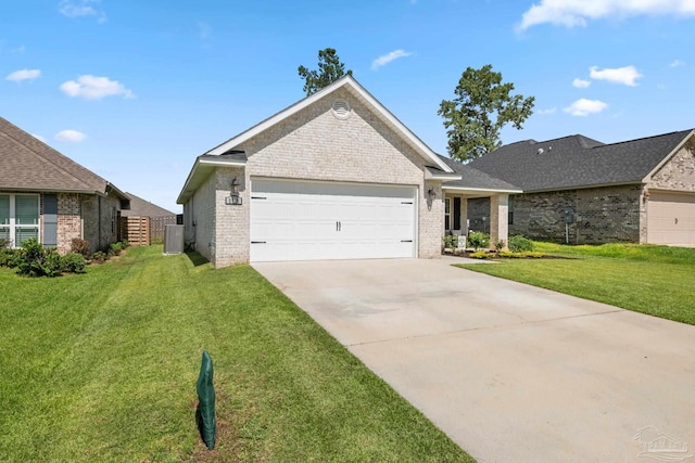 5726 Dunridge Dr, Pace, FL 32571 - ranch-style house with brick siding, a garage, cooling unit, and driveway