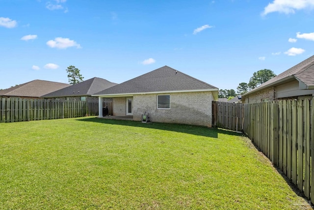5726 Dunridge Dr, Pace, FL 32571 - rear view of property featuring brick siding and roof with shingles