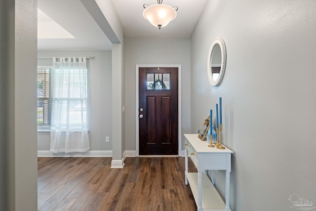 5726 Dunridge Dr, Pace, FL 32571 - entrance foyer with dark wood-style floors and baseboards