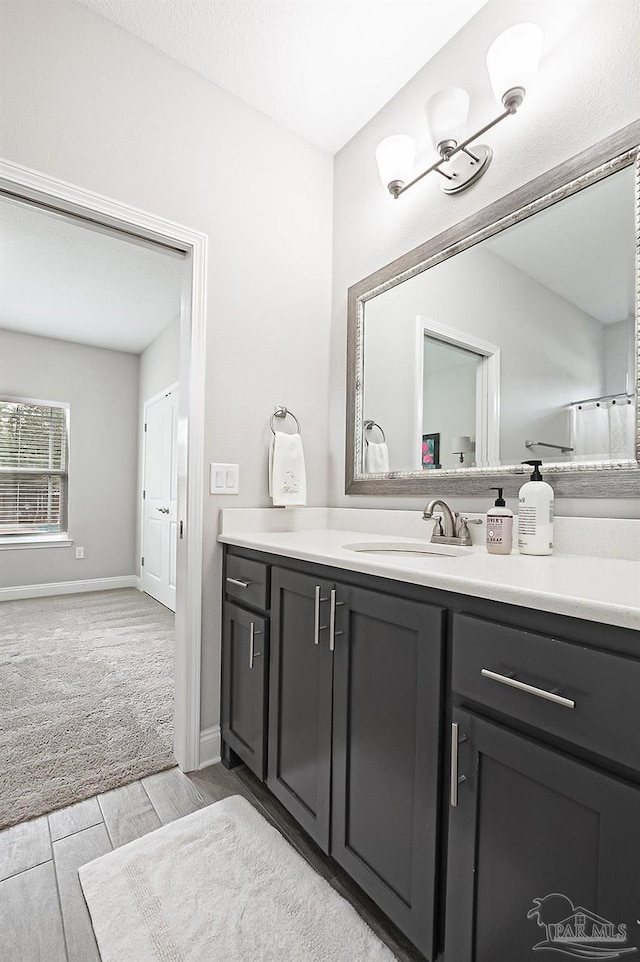 bathroom featuring vanity and hardwood / wood-style floors