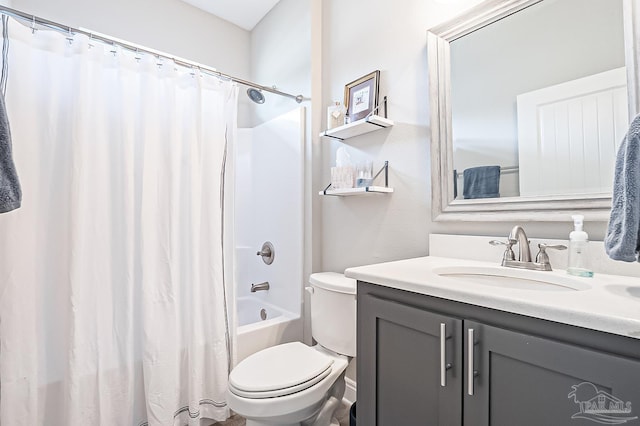 full bathroom featuring shower / bathtub combination with curtain, vanity, and toilet