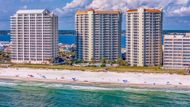 bird's eye view featuring a view of the beach and a water view