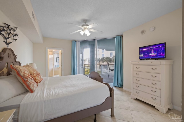 bedroom featuring access to exterior, ceiling fan, light tile patterned floors, and a textured ceiling