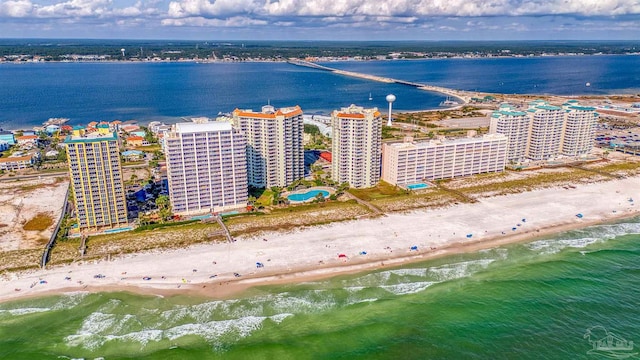 bird's eye view featuring a view of the beach and a water view