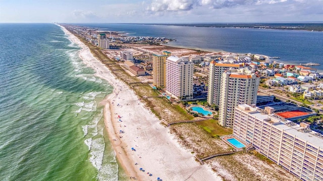 birds eye view of property with a beach view and a water view