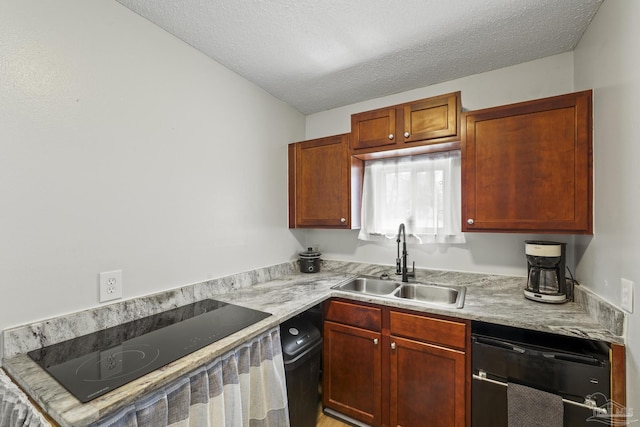 kitchen with a textured ceiling, black appliances, a sink, and light countertops