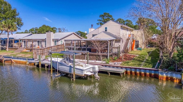 view of dock with a water view, boat lift, and stairs