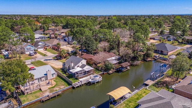 drone / aerial view featuring a water view and a residential view