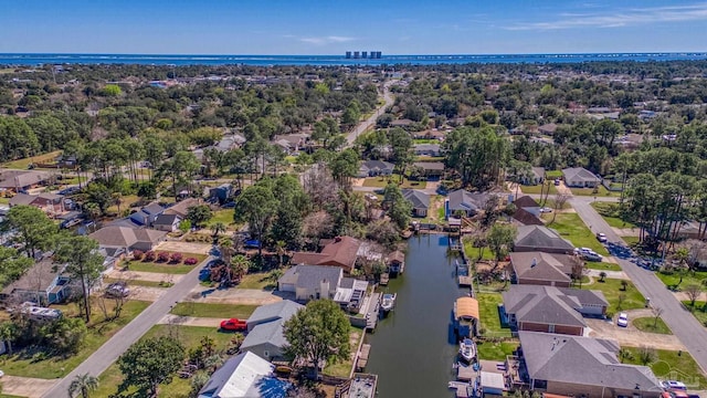 drone / aerial view featuring a residential view and a water view