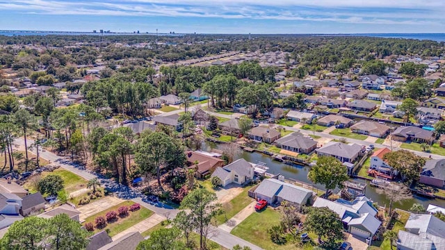 drone / aerial view featuring a residential view and a water view