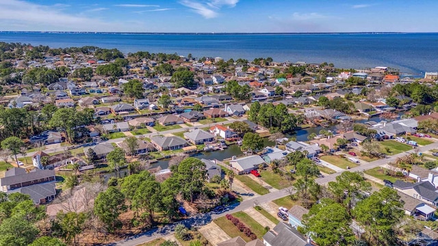 drone / aerial view with a water view and a residential view