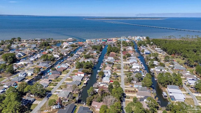 drone / aerial view with a water view and a residential view