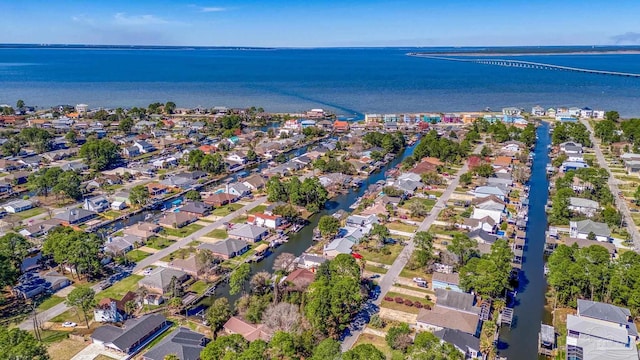 drone / aerial view with a residential view and a water view