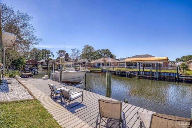 dock area featuring a residential view and a water view