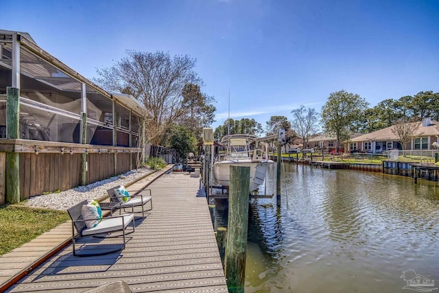 dock area with a water view and boat lift