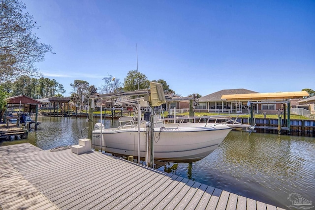 view of dock featuring a water view and boat lift