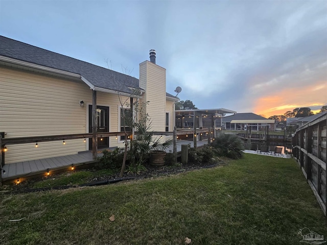 view of yard with fence and a wooden deck