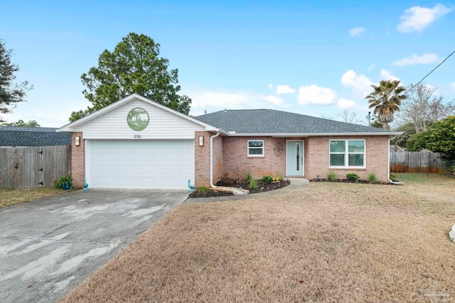 single story home with a garage and a front lawn