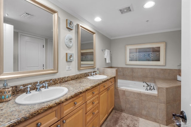 bathroom with tiled tub, tile patterned flooring, dual vanity, and ornamental molding