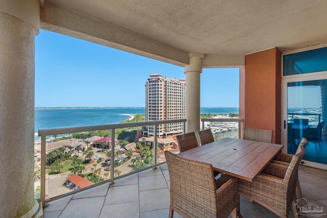 balcony featuring a water view