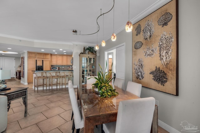 dining room with light tile patterned floors and ornamental molding