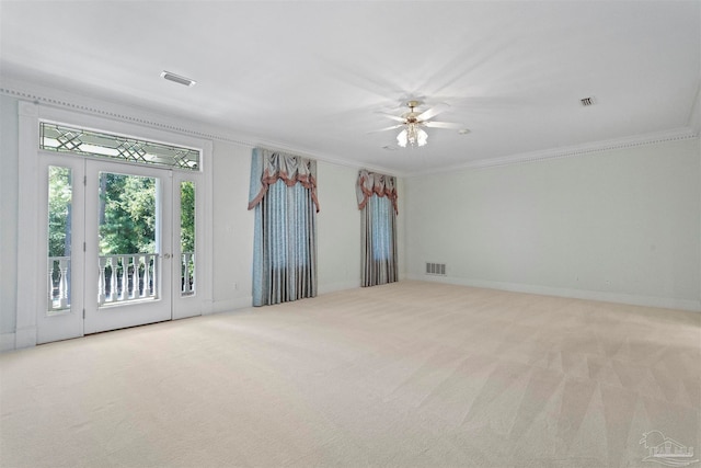 carpeted empty room with ornamental molding and ceiling fan