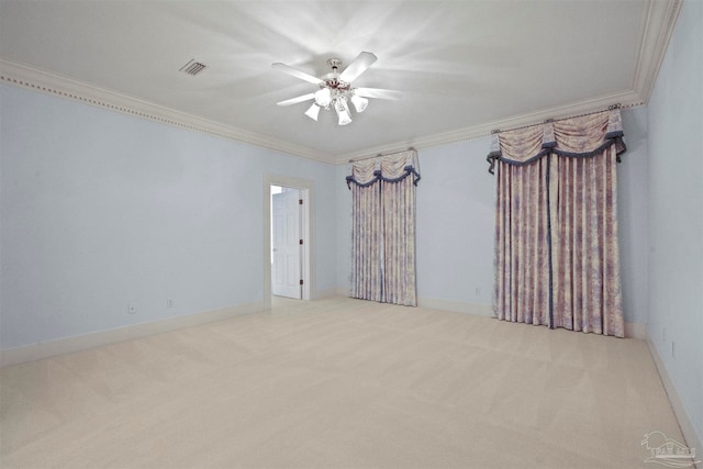 carpeted empty room with crown molding and ceiling fan