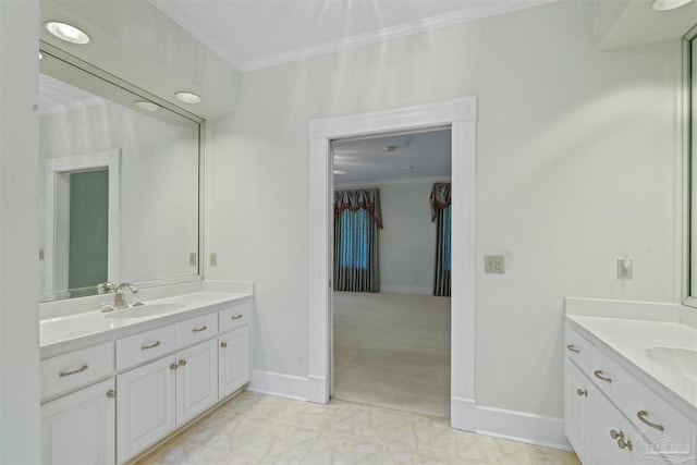 bathroom featuring tile patterned flooring, vanity, and crown molding