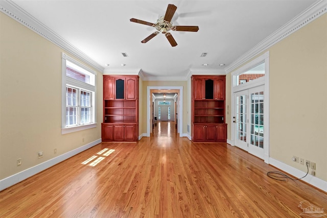 unfurnished living room featuring french doors, light hardwood / wood-style flooring, crown molding, and ceiling fan