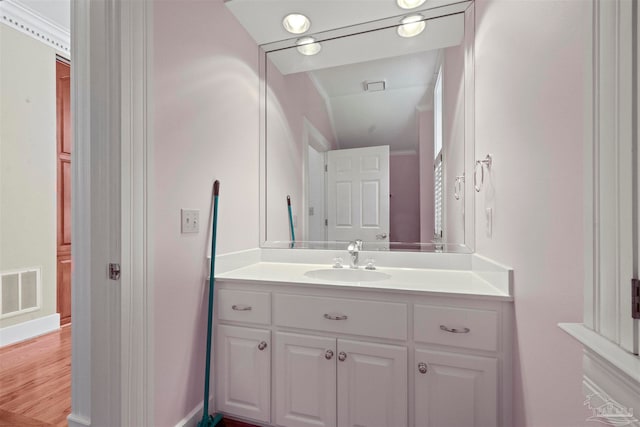 bathroom featuring wood-type flooring and vanity