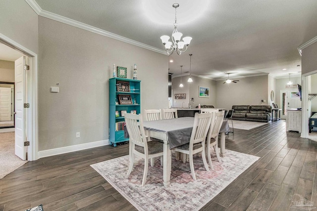 dining area with ornamental molding, a textured ceiling, dark hardwood / wood-style floors, and ceiling fan with notable chandelier