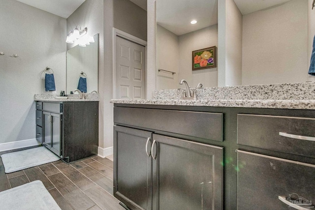 bathroom featuring vanity and hardwood / wood-style floors