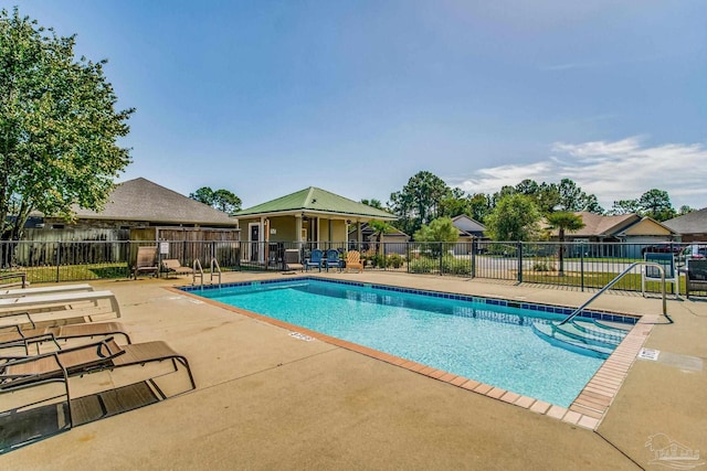 view of swimming pool with a patio