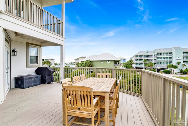 wooden deck with a grill