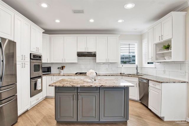 kitchen with stainless steel appliances and white cabinets