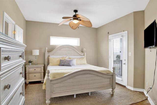 bedroom featuring ceiling fan and access to outside