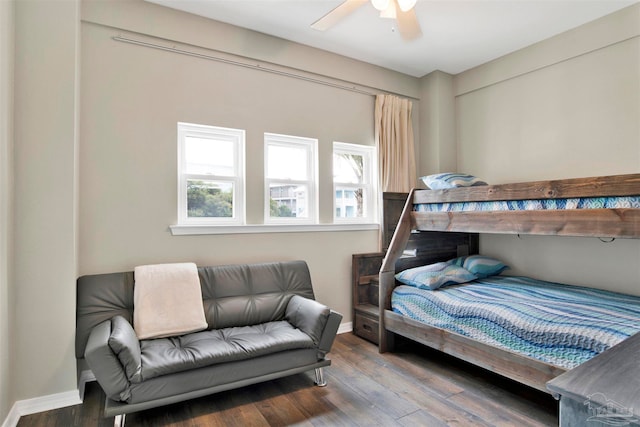 bedroom with ceiling fan and dark hardwood / wood-style flooring