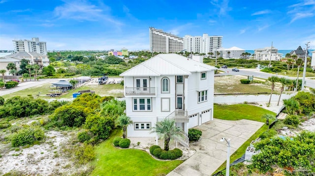 view of front of house featuring a garage and a balcony