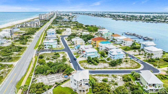 bird's eye view with a view of the beach and a water view