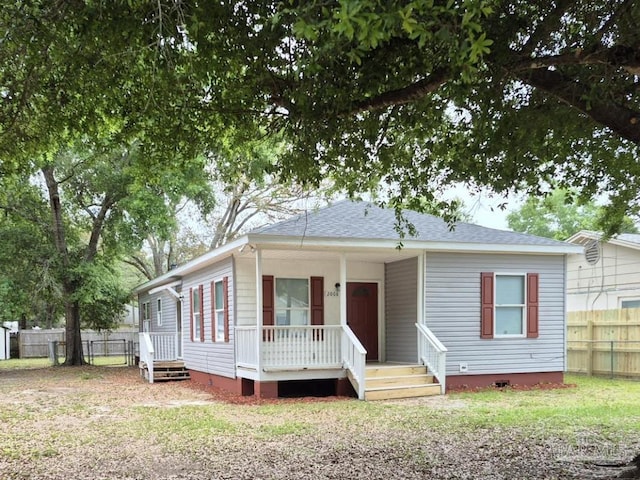 2008 Augusta Ave, Pensacola, FL 32507 - view of front of house with covered porch, crawl space, fence, and roof with shingles